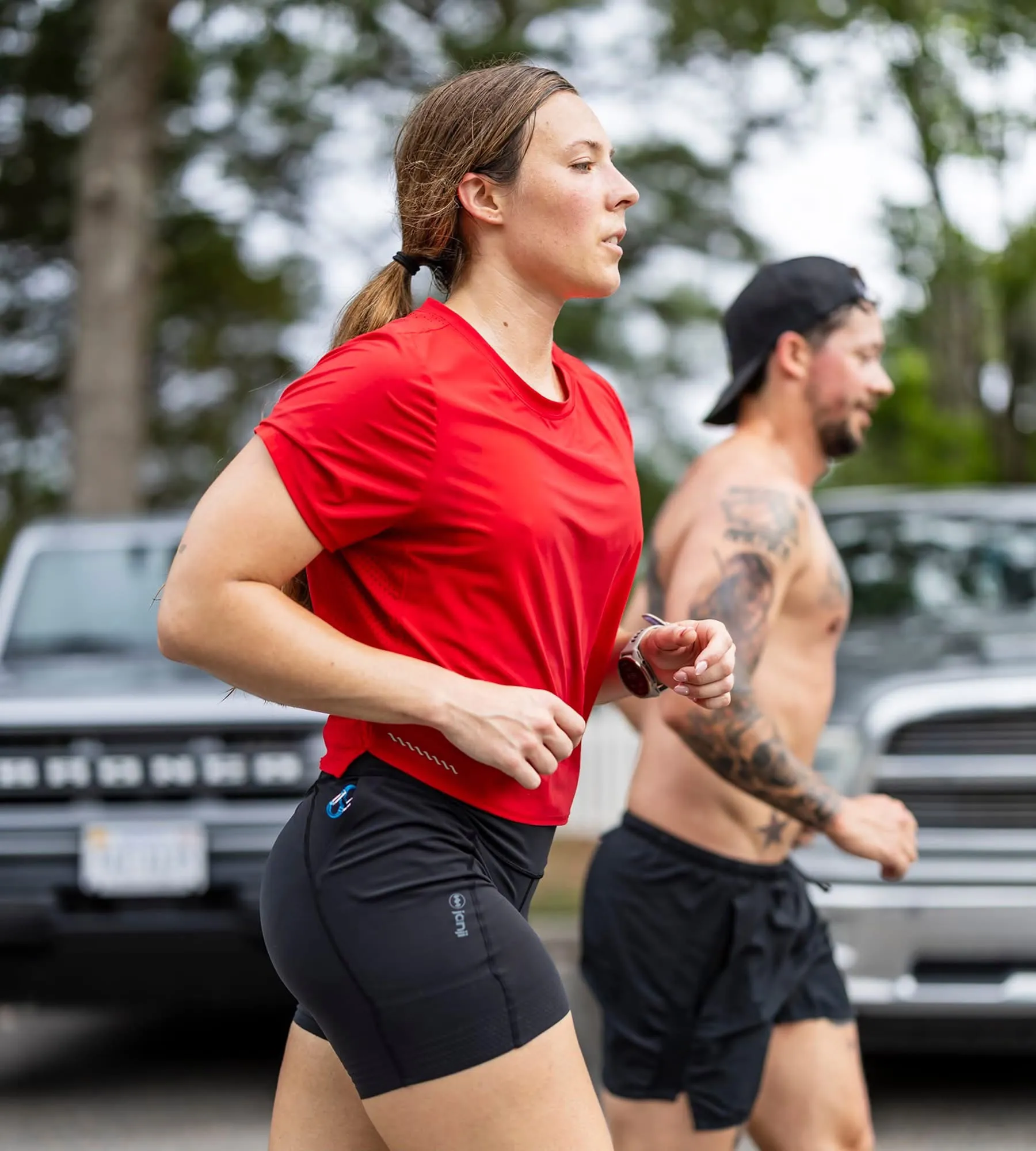 Lexi running alongside a training partner